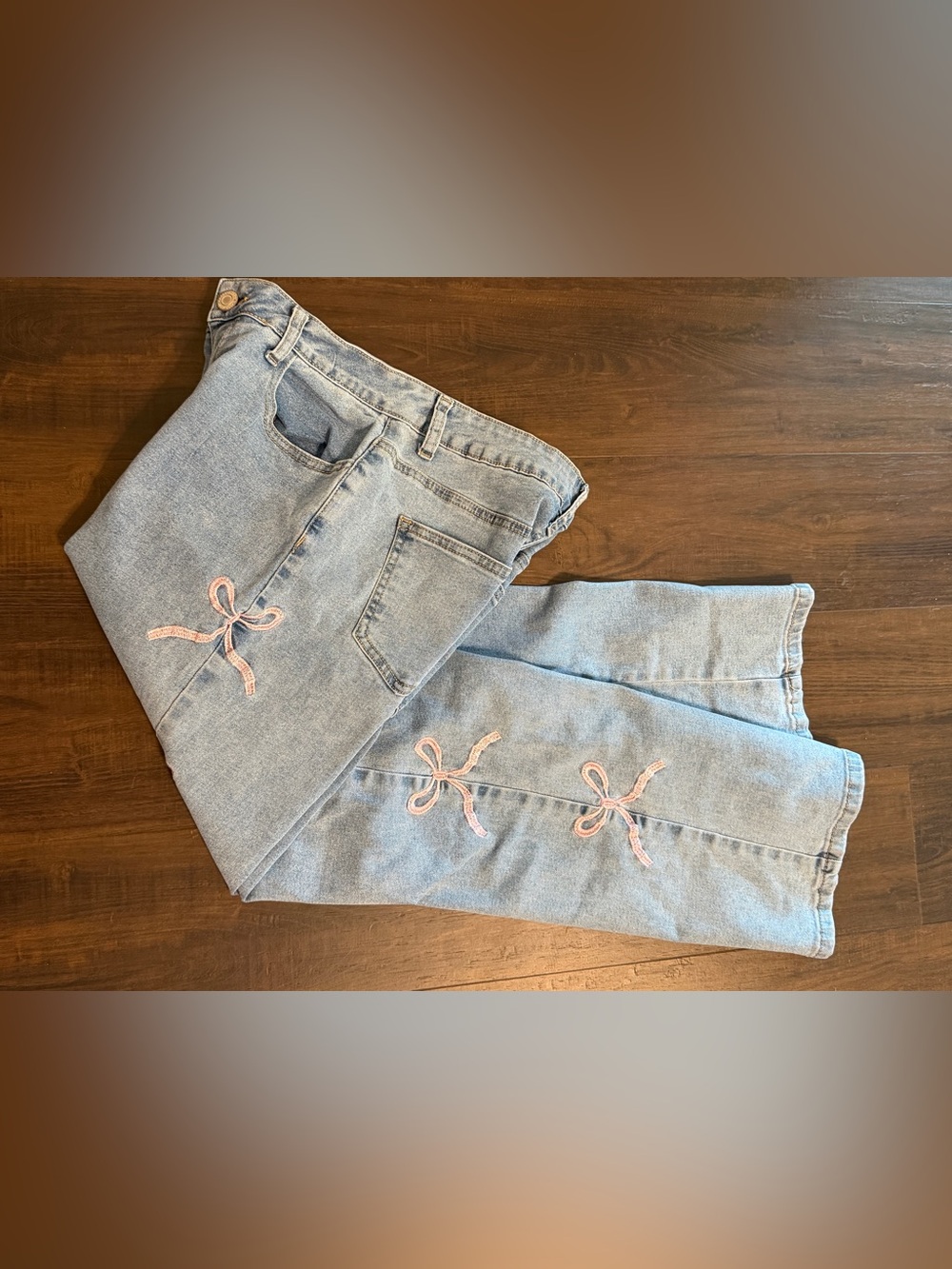 GOGO Light Wash Straight Leg Jeans with Pink Bow Accents